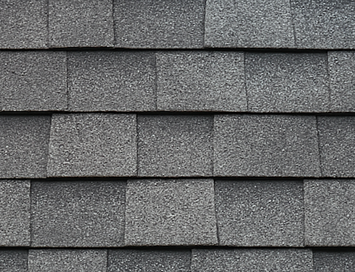 Close-up of gray asphalt shingles after soft washing, free of moss and stains