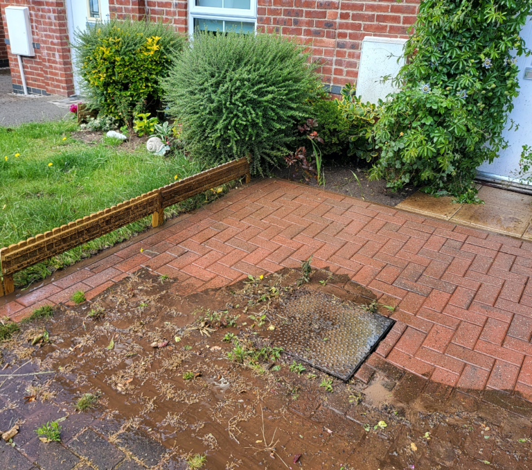 Brick paver driveway cleaning Westchester NY with visible improvement.
