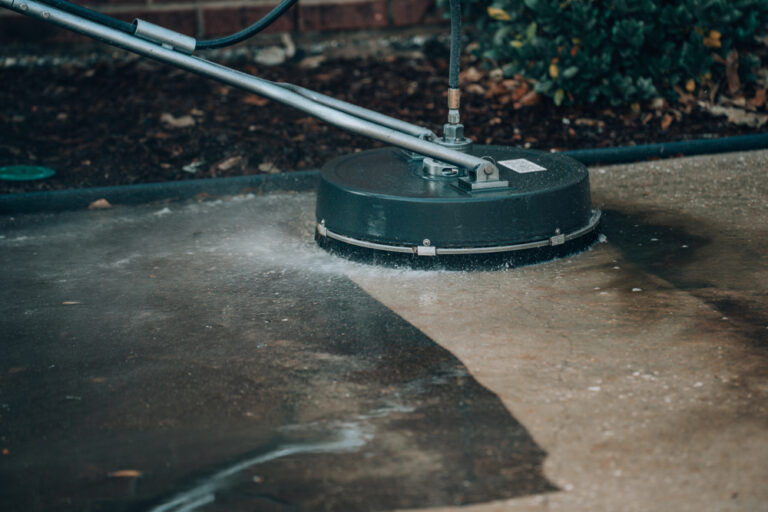 Surface cleaner restoring driveway during driveway cleaning Westchester NY.