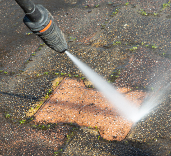 Brick walkway being deep-cleaned with power washing in Westchester NY to remove stains