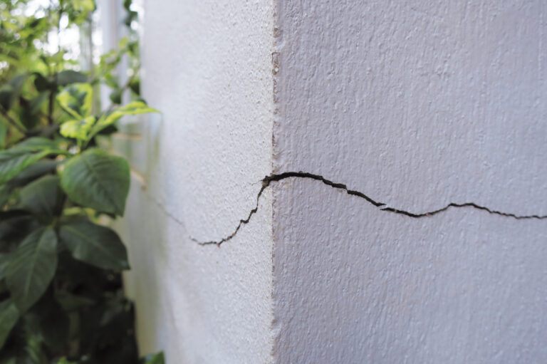 Foundation crack caused by water damage due to clogged gutters in Westchester NY