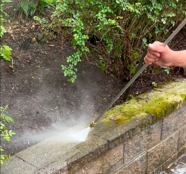 Sleepy Hollow NY power washing company cleaning moss-covered retaining wall