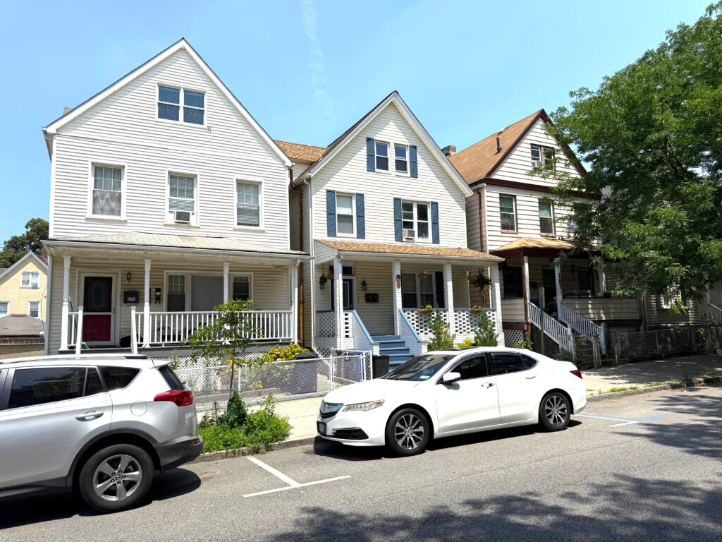 Three Yonkers homes with different types of siding including vinyl and composite