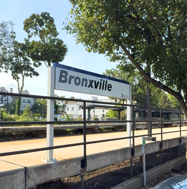 Bronxville NY train station sign at the Metro-North platform, showcasing the town’s iconic entry point.