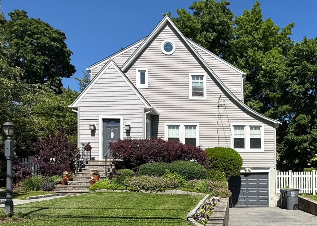 Beautiful White Plains NY home with a clean vinyl siding exterior maintained through professional power washing services.