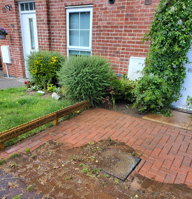 Freshly cleaned brick paver driveway and walkway restoration project completed by Pressure Clear Power Washing in White Plains NY